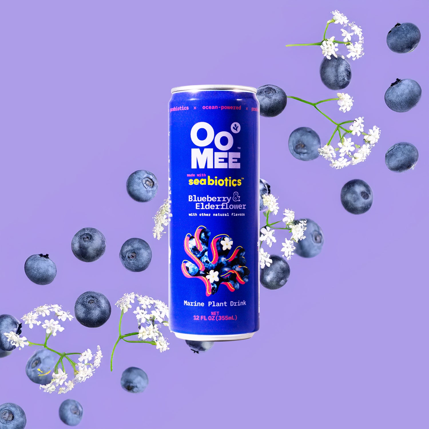 OoMee Blueberry & Elderflower marine plant drink can with seabotics, surrounded by fresh blueberries and elderflower blossoms on a vibrant purple background, highlighting its ocean-powered and plant-based ingredients.