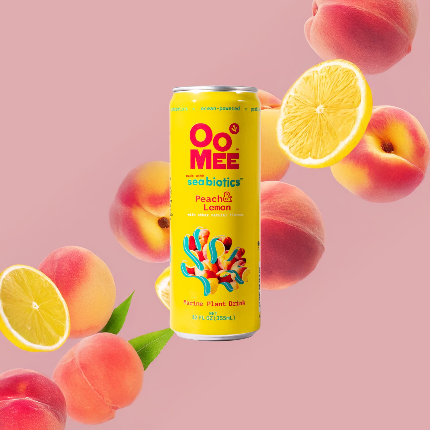 OoMee Peach & Lemon marine plant drink can made with seabotics, surrounded by fresh peaches and lemon slices on a soft pink background, emphasizing its refreshing ocean-powered, and plant-based formula.