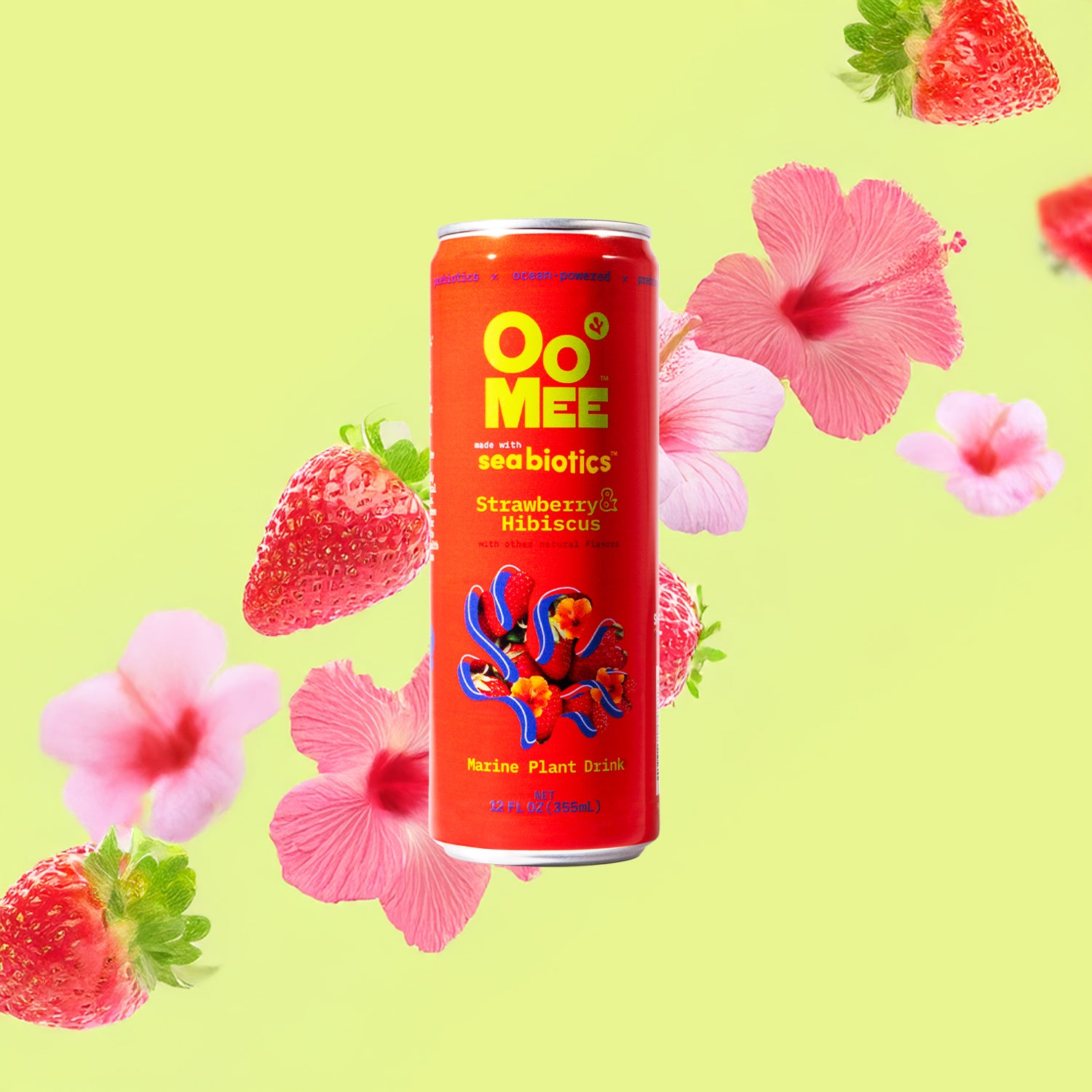 OoMee Strawberry & Hibiscus marine plant drink can with seabotics, surrounded by fresh strawberries and hibiscus flowers on a bright green background, highlighting its ocean-powered, vegan, and wellness benefits.