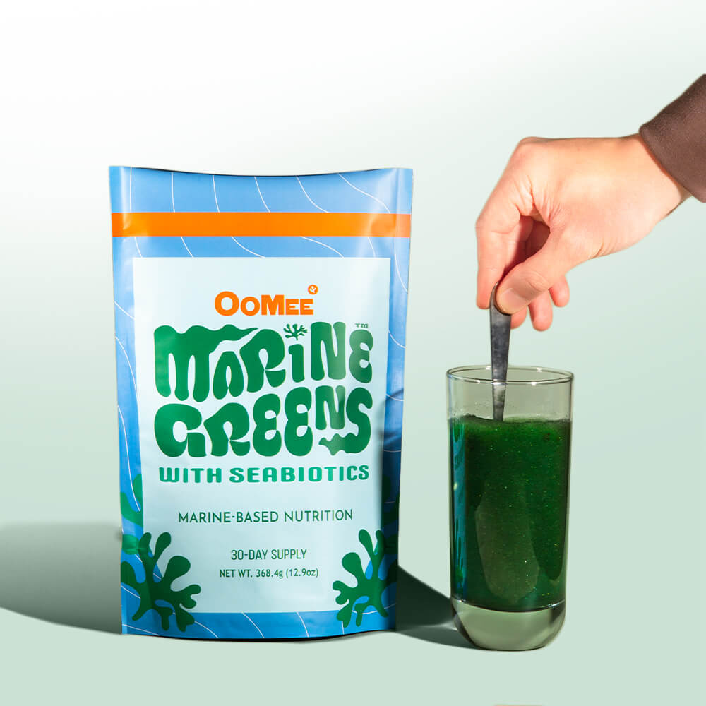 OoMee Marine Greens Powder – 30-Day Supply Stand-Up Pouch with Seabiotics™ Marine-Based Nutrition, in Front of a Vibrant Blue, Yellow, and Green Gradient Background.