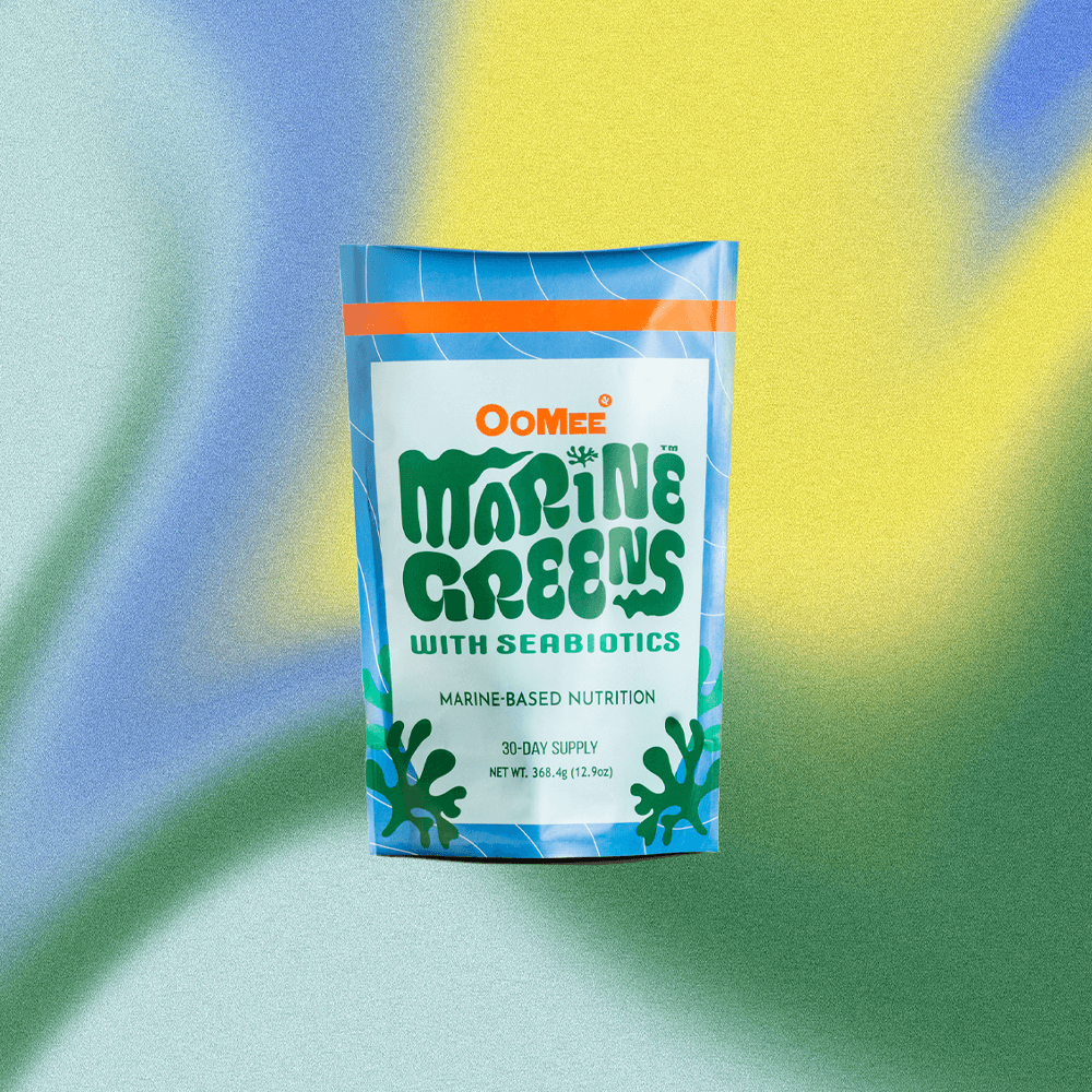 OoMee Marine Greens Powder – 30-Day Supply Stand-Up Pouch with Seabiotics™ Marine-Based Nutrition, in Front of a Vibrant Blue, Yellow, and Green Gradient Background.