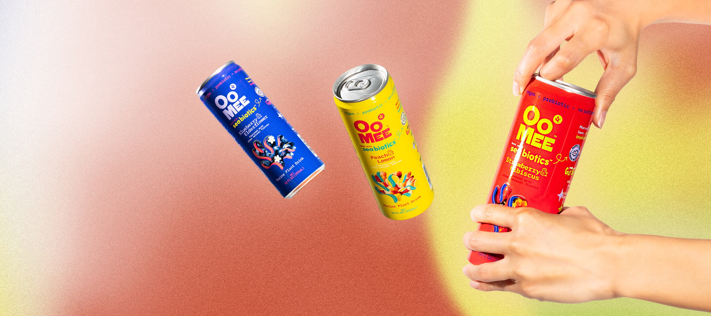 OoMee Beverage Banner - Strawberry & Hibiscus Flavor Can Being Opened, with Peach & Lemon and Blueberry & Elderflower Cans Floating in Front of a Red and Yellow Gradient Background. Vegan, Prebiotic Marine Plant Drink for Gut Health and Craving Control.